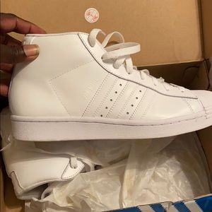 White mid top shell toe adidas